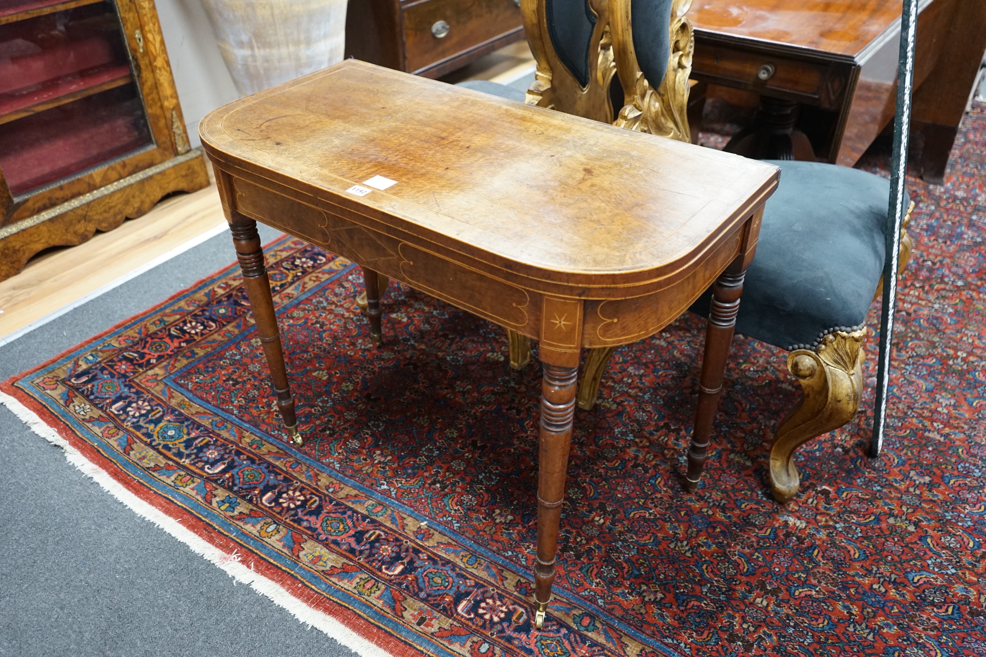 A Regency banded and inlaid mahogany D shaped folding card table, width 91cm, depth 45cm, height 70cm